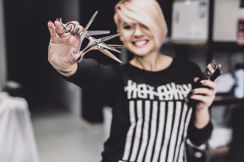 Hairdresser holding scissors