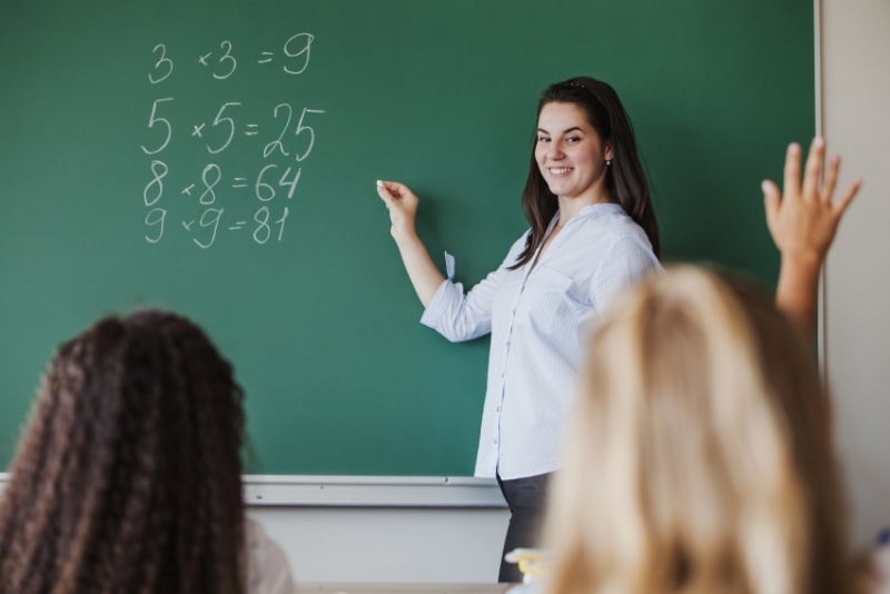 Teacher in classroom.