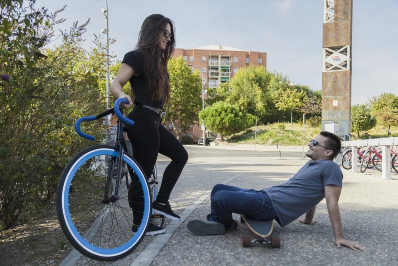 Friends talking on street.