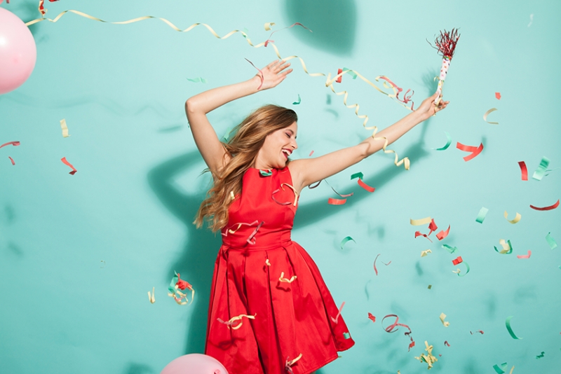 A woman dancing with confetti
