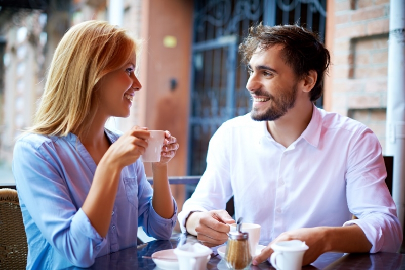 Couple talking and having coffee